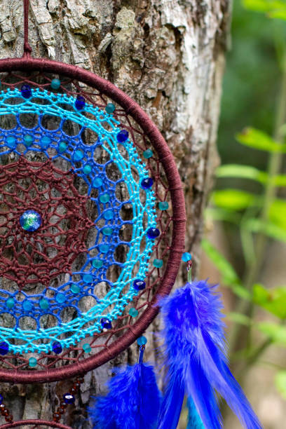 istock Handmade dream catcher with feathers threads and beads rope hanging 1271067297