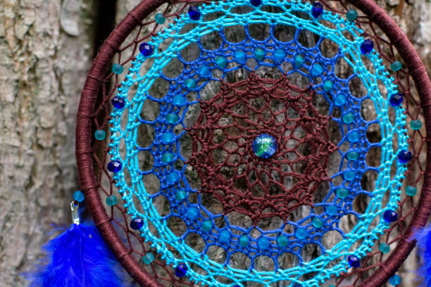 istock Handmade dream catcher with feathers threads and beads rope hanging 1271067298