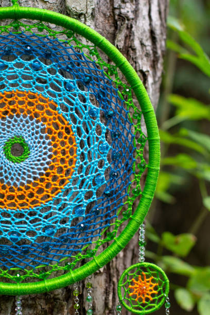 istock Handmade dream catcher with feathers threads and beads rope hanging 1271067306