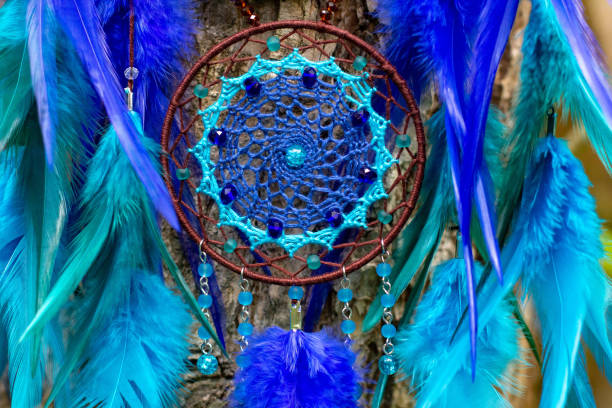 istock Handmade dream catcher with feathers threads and beads rope hanging 1271067307