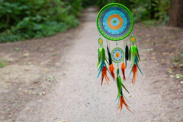 istock Handmade dream catcher with feathers threads and beads rope hanging 1271067317
