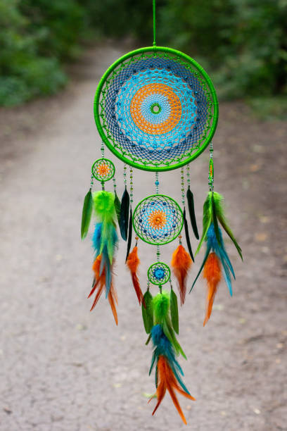 istock Handmade dream catcher with feathers threads and beads rope hanging 1271067318
