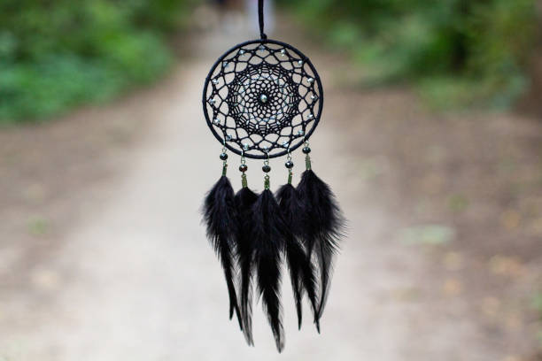 istock Handmade dream catcher with feathers threads and beads rope hanging 1271067327