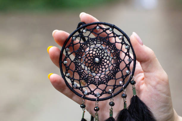istock Handmade dream catcher with feathers threads and beads rope hanging 1271067329