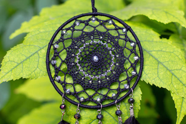 istock Handmade dream catcher with feathers threads and beads rope hanging 1271067334