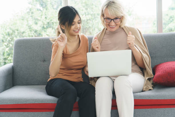 istock The mother and daughter are at home using the laptop. 1271069062