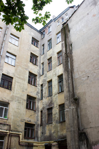 istock Old courtyard in St. Petersburg. Building's facade 1271069328