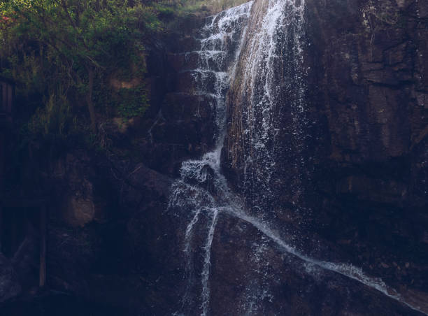istock close up view of small clean waterfall on rocky cliff 1271071087