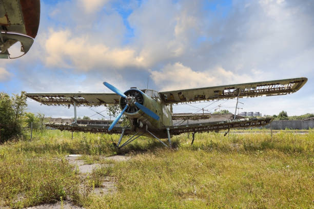 istock Abandoned green small propeller plane. Airplane graveyard 1271072292