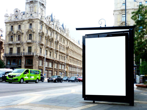 bus shelter on urban downtown street. white poster and ad display and light box stock photo