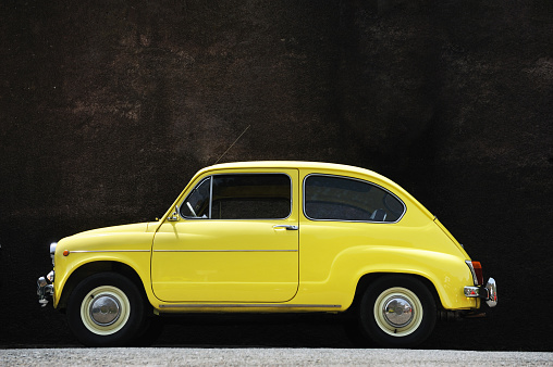 Yellow vintage car. Retro car in the mountains of Madeira.