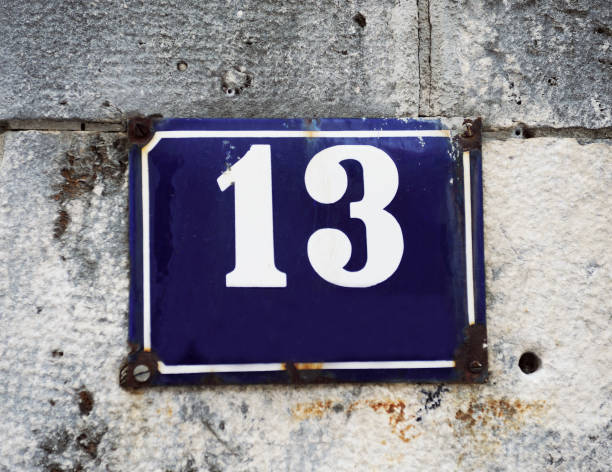 istock Old-fashioned enamel sign with house number 13 1271079733