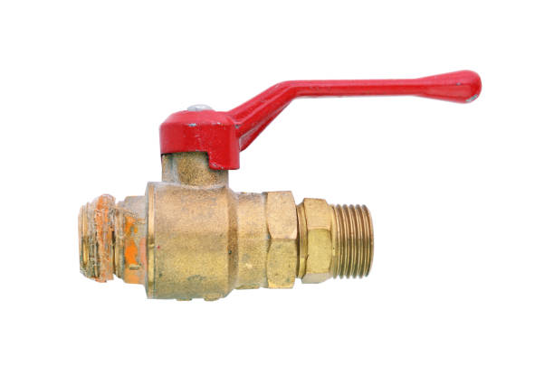 A metal ball valve with a red handle isolated on a white background.