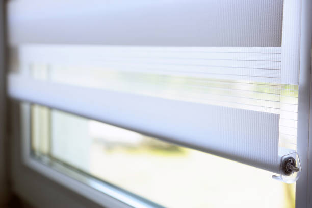 istock Window with white jalousie, close up.Windows with white venetian blinds. Close-up view. 1271081920