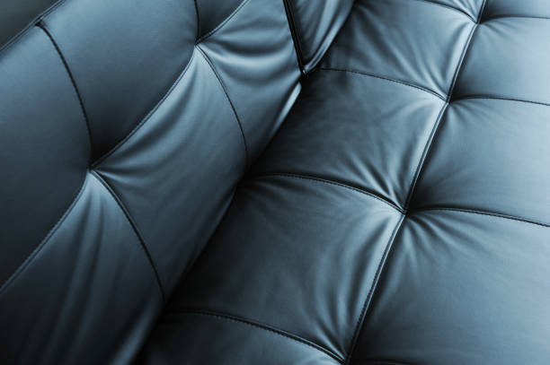 istock Black leather sofa, Luxury leather button-tufted black chair texture, Black luxury old leather skin background, Sofa leather texture background. 1271081973
