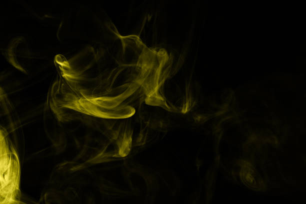 istock Yellow steam on a black background. 1271084406