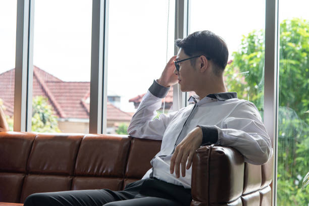 istock Financial problem concept. Young smart businessman has financial status depressed and anxious about cashflow and financial accounting 1271084808