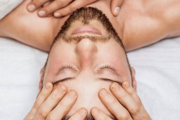 istock Young man receiving head massage. 1271085667