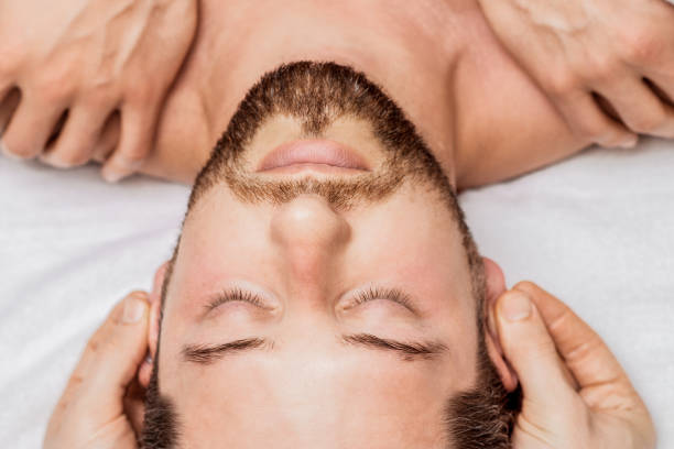 istock Man receiving relaxing head massage. 1271085675