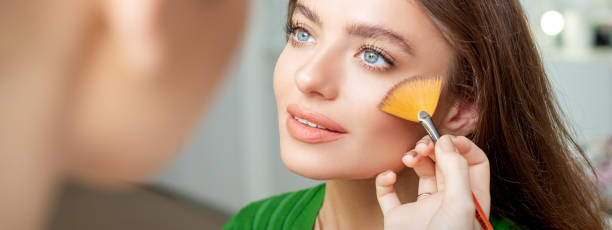 istock Professional make up artist applying powder 1271085734