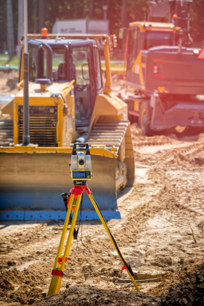 istock Landsurveyor equipment on a highway construction site 1271087137