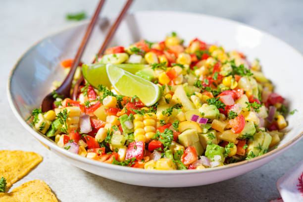 istock Mexican corn salad in white plate. Mexican food concept. 1271087279