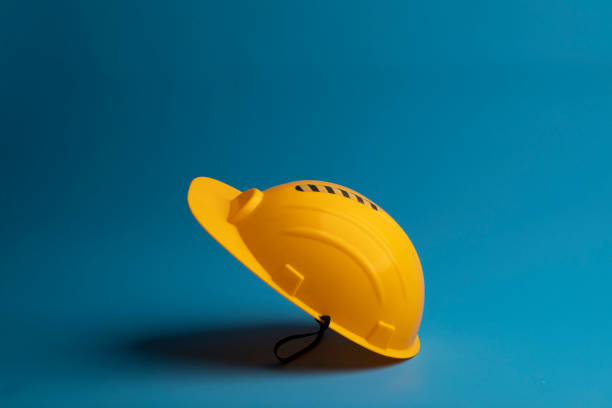 istock Yellow Safety helmet on blue background 1271088622