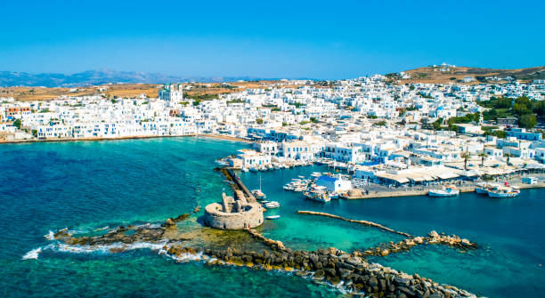 Aerial view of ruins of Venetian castle in Naoussa Ancient ruins of Venetian castle in the harbor of Naoussa town, view from above, Paros island, Greece paros stock pictures, royalty-free photos & images