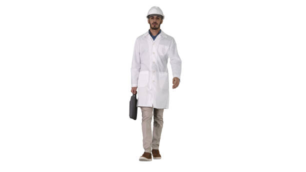istock Professional engineer with suitcase and in helmet walking on white background 1271099793