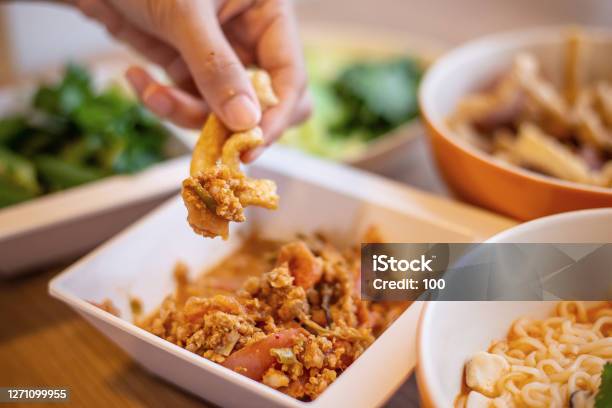 People Dip Crispy Stuff With Thai Deliciou Red Chili Dip Nam Prik Ong Stock Photo - Download Image Now