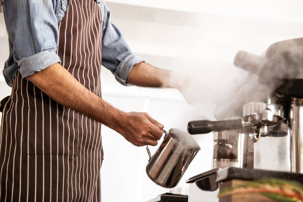 istock Barista steamed coffee jar by machine 1271102239