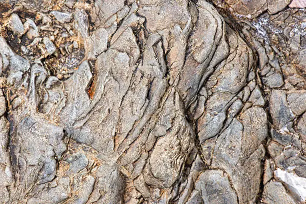 Detailed closeup macro photo of rock, texture background.