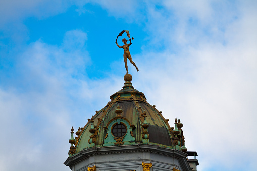 Copper cupola with statue on historical building of Grand Place in Brussels