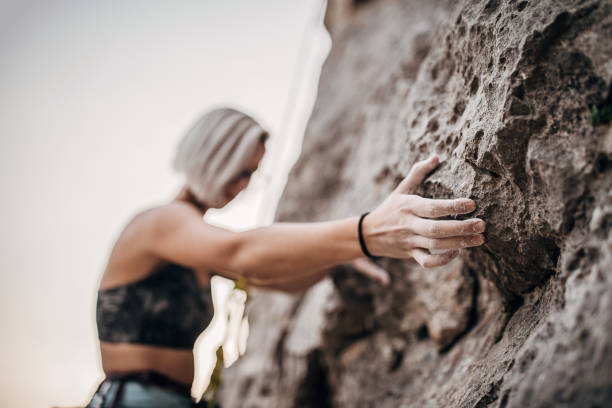 istock Focus on female rock climbing hand with chalk 1271103797