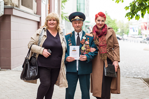 Chisinau / Moldova - May 15, 2020: portrait of veteran soldier receiving an award during celebration of the USSR victory day over Germany in World War II