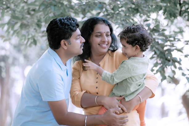 istock Family has fun playing in the park 1271104414