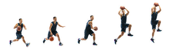 young basketball player against white studio background in motion of step-to-step goal - made man object imagens e fotografias de stock