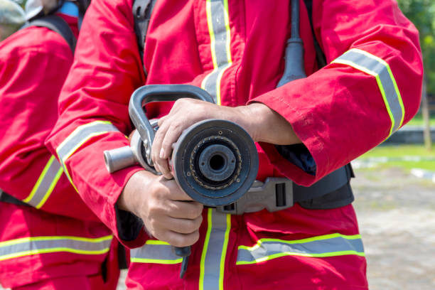 istock Firefighters in fire protection suit holding a water hose 1271105522