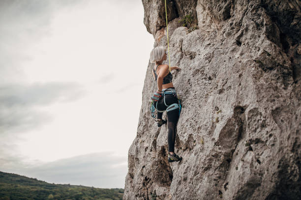 istock One young athletic female free climber using chalk 1271106163