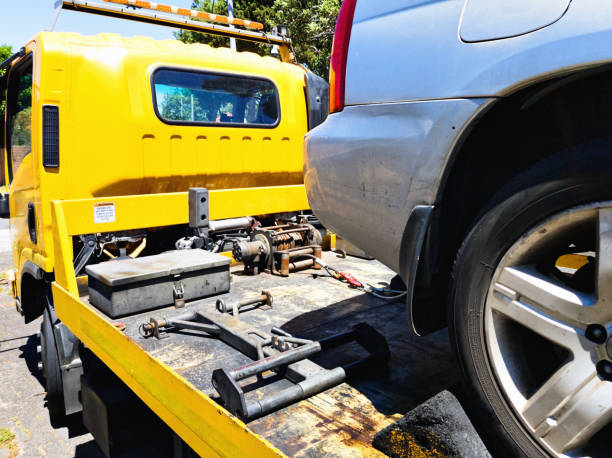 istock Car being secured to a flatbed tow truck after breakdown 1271106681