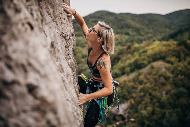 istock Young athletic female free climber 1271108301