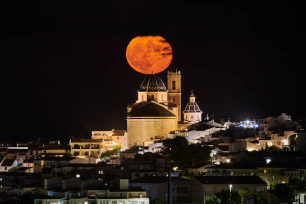 istock Full moon rise over town 1271108469