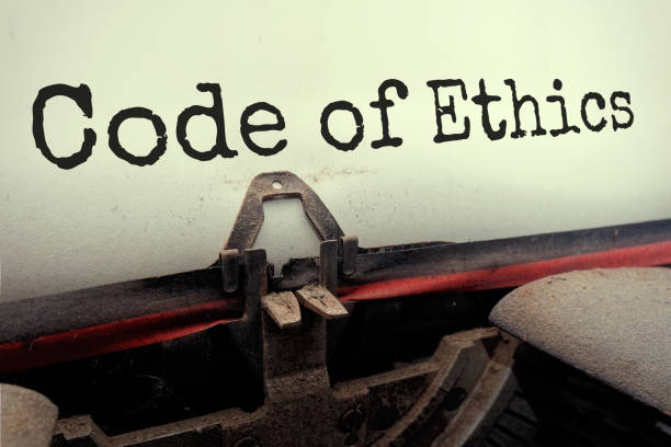 Text Code of Ethics typed on retro typewriter perspective view Code of Ethics typed on retro typewriter perspective view. code of ethics stock pictures, royalty-free photos & images