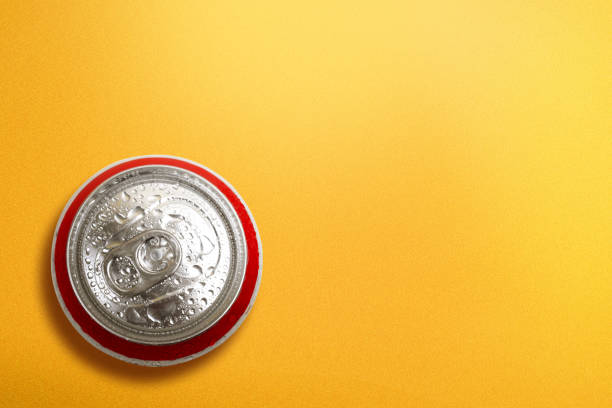 istock Top view of beer can with a yellow background 1271109092