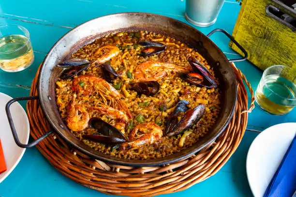 Photo of Seafood paella in metal pan