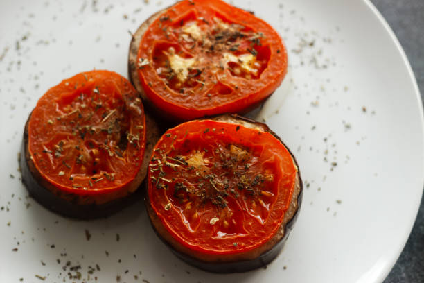 istock Baked eggplant with tomatoes. Eggplant on a plate 1271110423