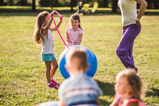 istock Group of kids playing in nature 1271112639