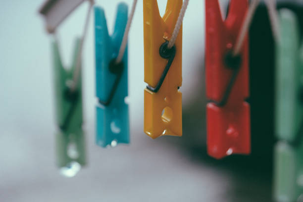 istock Coloured clothespins after a rain shower 1271115611