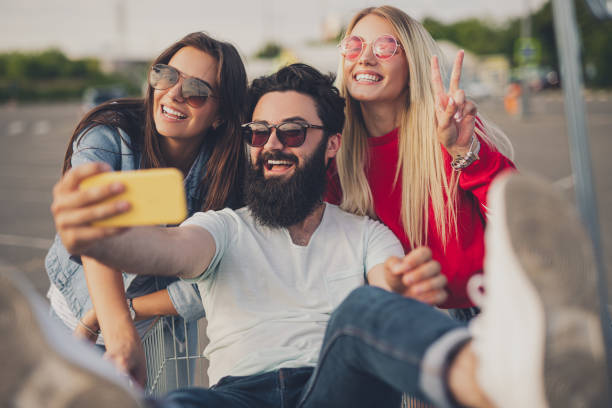 istock Happy friends taking selfie during shopping 1271115648