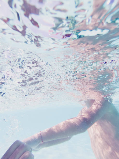 istock Underwater view of boy in pool. 1271119730